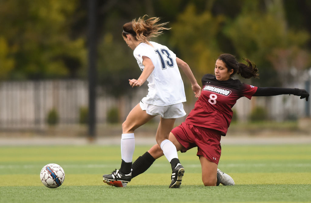 Brianna Heath evades a slide tackle